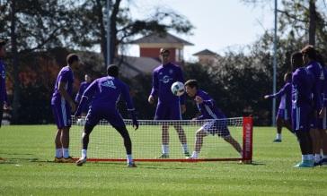 Players participate in soccer tennis to warm up during training prior to Orlando City SC's media day on Friday, February 26, 2016. (Victor Ng / Orlando Soccer Journal)