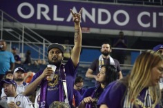 A fan raises his hand in preparation to cheer on the Orlando City Lions in a match against the Chicago Fire in the Orlando Citrus Bowl on Friday, March 11, 2016. The match ended in a 1-1 draw. (Victor Ng / Orlando Soccer Journal)